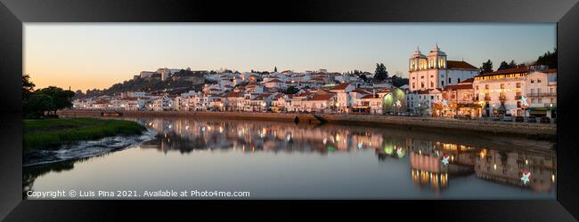 Panorama view of Alcacer do Sal cityscape from the other side of the Sado river at sunset Framed Print by Luis Pina