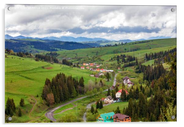 A picturesque landscape of a Carpathian village with a winding road and colorful roofs in early spring. Acrylic by Sergii Petruk