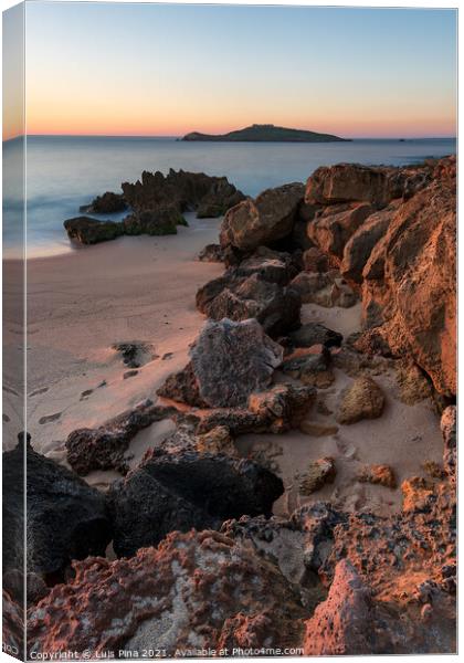 Porto Covo beach at sunset with Ilha do Pessegueiro Island on the background, in Portugal Canvas Print by Luis Pina