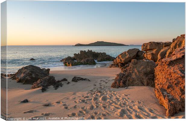 Porto Covo beach at sunset with Ilha do Pessegueiro Island on the background, in Portugal Canvas Print by Luis Pina