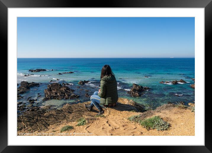 Woman looking at Praia da Samoqueira Framed Mounted Print by Luis Pina