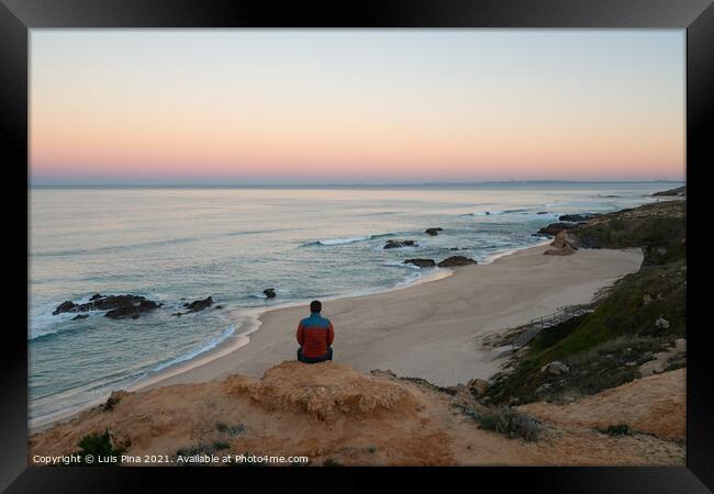 Man seeing Praia do Malhao beach view at sunrise, in Portugal Framed Print by Luis Pina