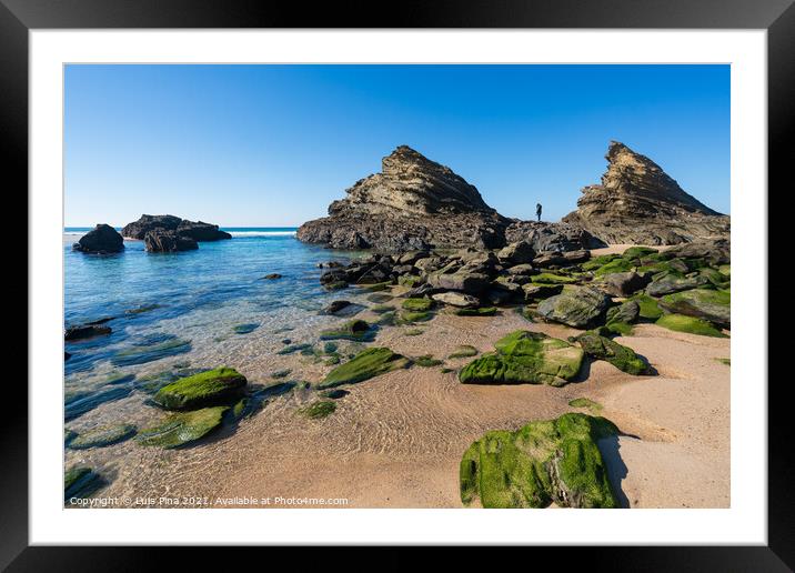 Woman on the rocks at Praia da Samoqueira beach in Portugal Framed Mounted Print by Luis Pina