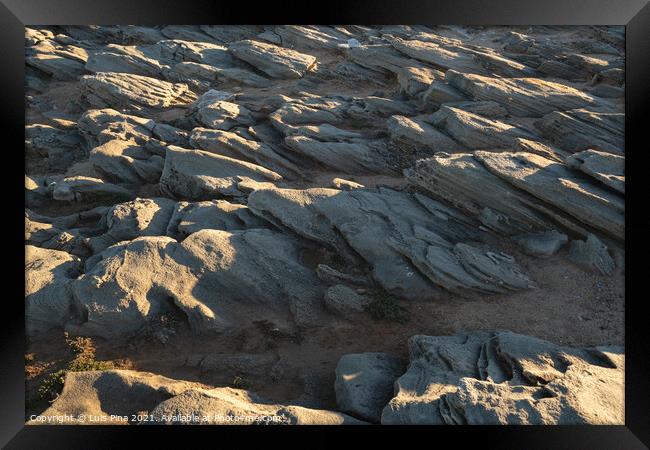 Details on sand rocks at Praia do Malhao beach, in Portugal Framed Print by Luis Pina