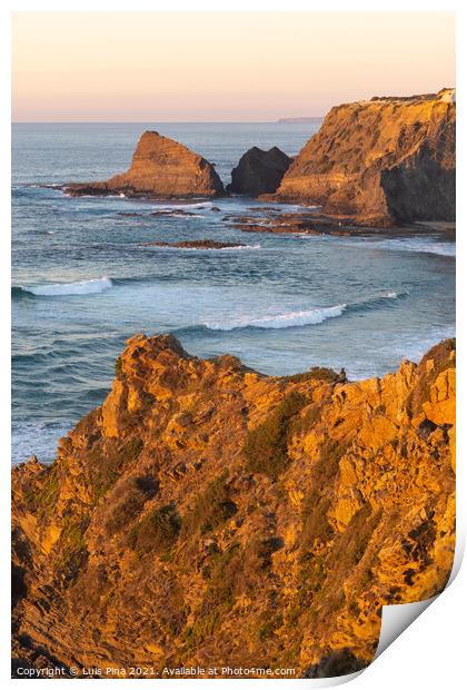 Woman on a cliff at Praia de Odeceixe in Costa Vicentina, Portugal Print by Luis Pina