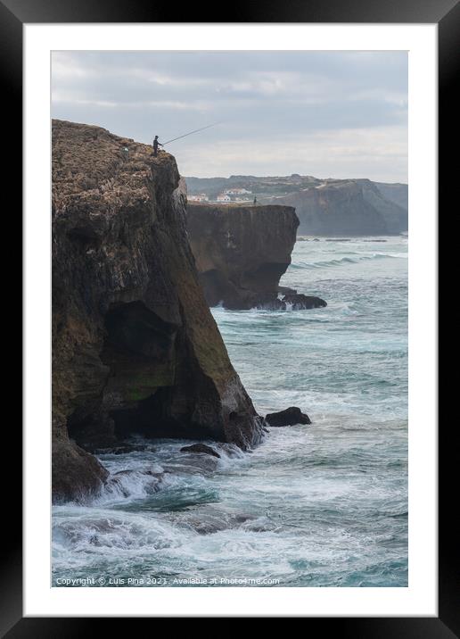 Fishermen fishing in Praia de Aljezur beach sea cliff edge, in Portugal Framed Mounted Print by Luis Pina