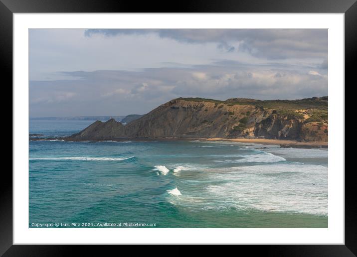 Aljezur beach with waves crashing and sea cliffs on the background Framed Mounted Print by Luis Pina
