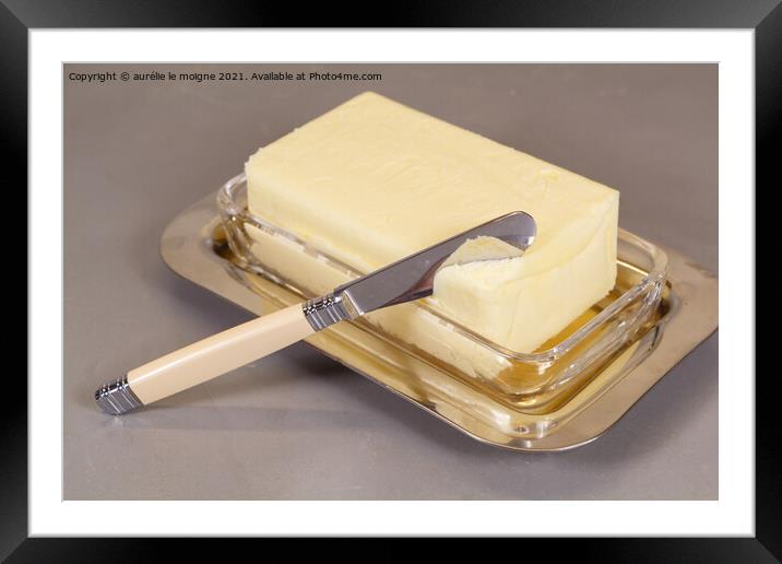 Pack of butter in a butter dish Framed Mounted Print by aurélie le moigne