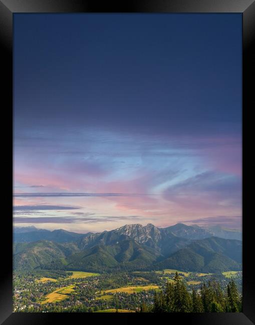 Vertical view of mountains in nature of sleeping knight tatra mountain covered with dramatic clouds aka as giewont and dramatic sunset or sunrise located in Zakopane, South Poland, Europe. Framed Print by Arpan Bhatia