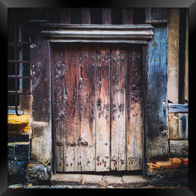 Ancient weathered wooden doorway Framed Print by Chris Rose