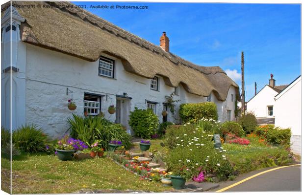 Thatched roof cottage Canvas Print by Kevin Britland