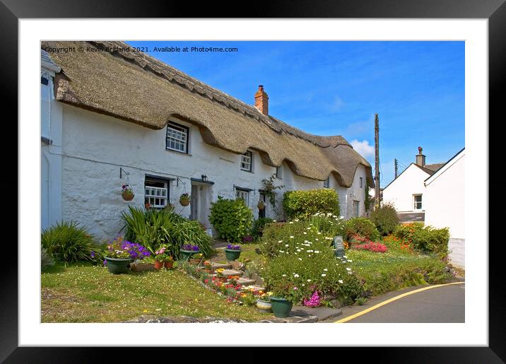 Thatched roof cottage Framed Mounted Print by Kevin Britland