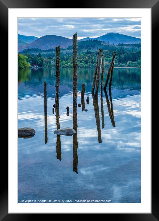 Old jetty piles on Derwentwater Framed Mounted Print by Angus McComiskey