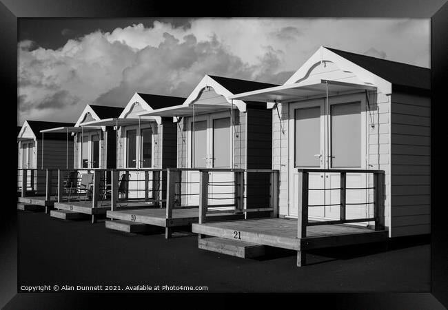 Beach huts Framed Print by Alan Dunnett