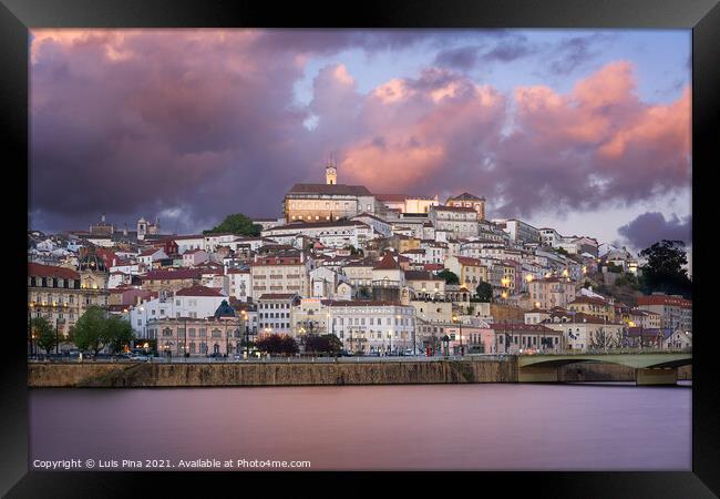 Coimbra city view at sunset with Mondego river and beautiful historic buildings, in Portugal Framed Print by Luis Pina