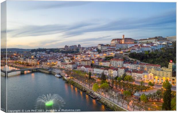 Coimbra drone aerial city view at sunset with colorful fountain in Mondego river and beautiful historic buildings, in Portugal Canvas Print by Luis Pina