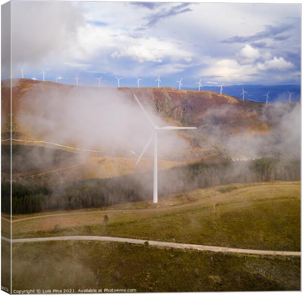 Wind turbines drone aerial view renewable energy on the middle of clouds in Serra da Lousa, Portugal Canvas Print by Luis Pina