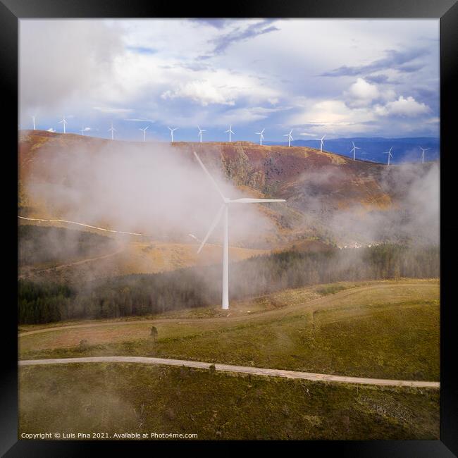Wind turbines drone aerial view renewable energy on the middle of clouds in Serra da Lousa, Portugal Framed Print by Luis Pina