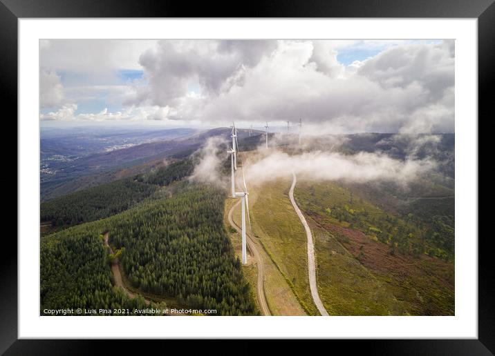 Wind turbines drone aerial view renewable energy on the middle of clouds in Serra da Lousa, Portugal Framed Mounted Print by Luis Pina