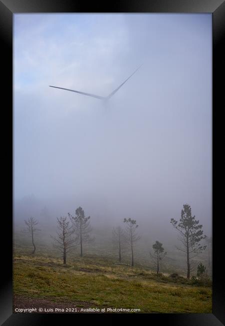 Wind turbines renewable energy on the middle of clouds in Serra da Lousa, Portugal Framed Print by Luis Pina
