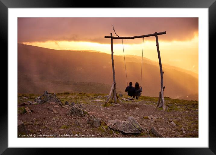 Romantic couple social distancing swinging on a Swing baloico in Lousa mountain, Portugal at sunset Framed Mounted Print by Luis Pina