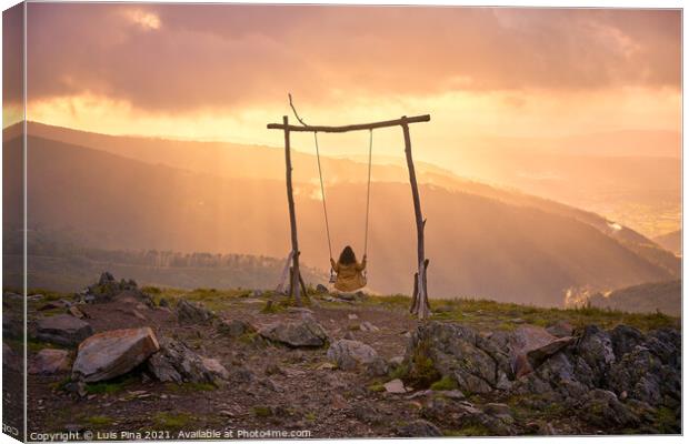 Woman girl social distancing swinging on a Swing baloico in Lousa mountain, Portugal at sunset Canvas Print by Luis Pina