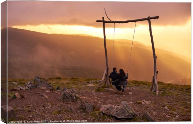 Romantic couple swinging on a Swing baloico in Lousa mountain, Portugal at sunset Canvas Print by Luis Pina