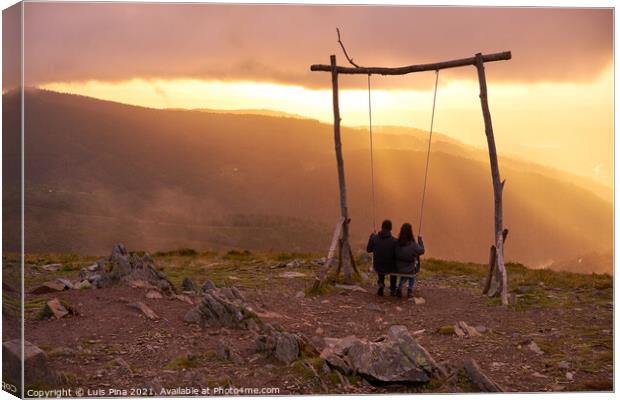 Romantic couple swinging on a Swing baloico in Lousa mountain, Portugal at sunset Canvas Print by Luis Pina