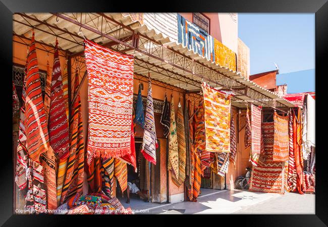 Carpets hanging outside a shop Framed Print by Kevin Hellon