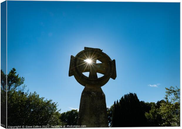 Celtic Cross with sun star burst through the upper left hand quadrant Canvas Print by Dave Collins