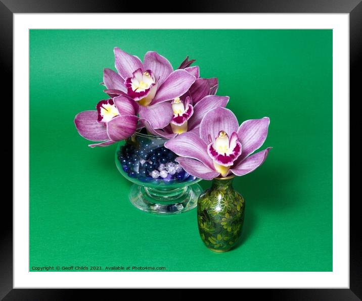 Pretty lavender pink Cymbidium Clarisse Orchids in vases. Framed Mounted Print by Geoff Childs