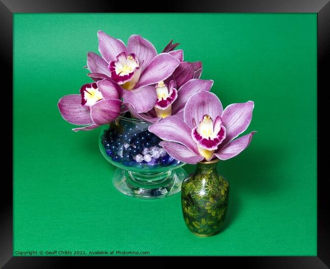 Pretty lavender pink Cymbidium Clarisse Orchids in vases. Framed Print by Geoff Childs