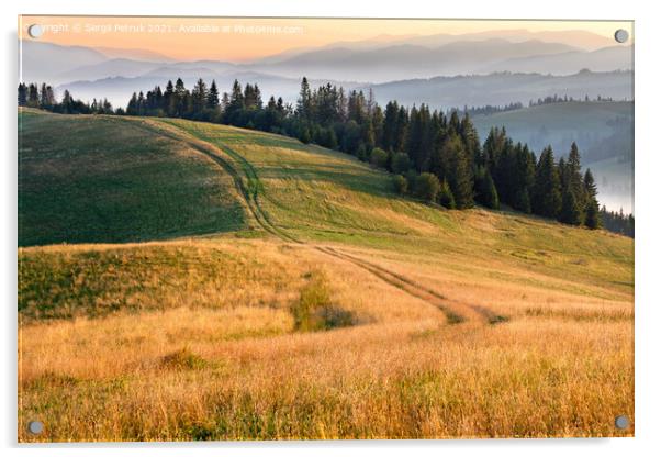 Morning landscapes of the mountainous Carpathians, sunrise illuminates the rural road that runs along the ridge of the hill. Acrylic by Sergii Petruk