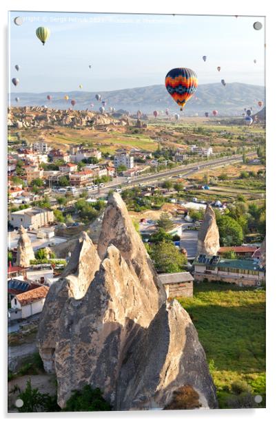 Dozens of balloons fly over the city of Goreme in Turkey and over the valleys of Cappadocia. Acrylic by Sergii Petruk