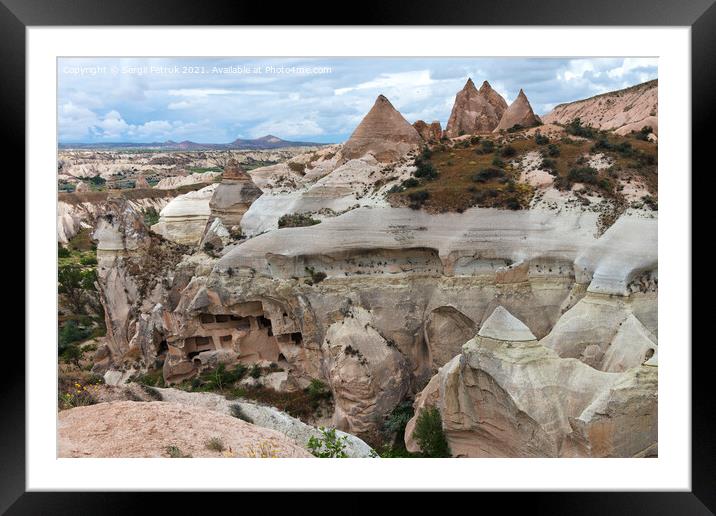 Ancient caves in the rocky mountain ranges of Cappadocia, an unusual landscape of central Turkey. Framed Mounted Print by Sergii Petruk