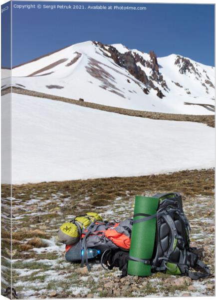 Camping equipment against the background of a snow-capped mountain and blue sky. Canvas Print by Sergii Petruk