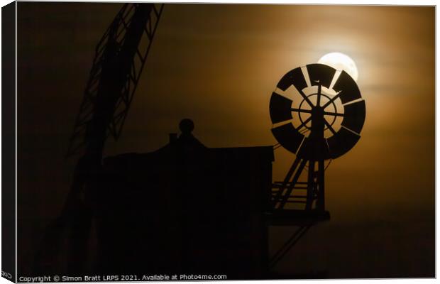Cley windmill silhouette with full moon fantail Canvas Print by Simon Bratt LRPS