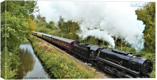 The Majestic Steam Train Rushing Through the Fores Canvas Print by Mark Chesters