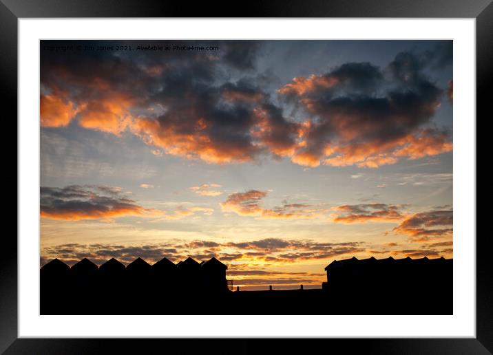 Silhouetted Beach Huts at Blyth Framed Mounted Print by Jim Jones