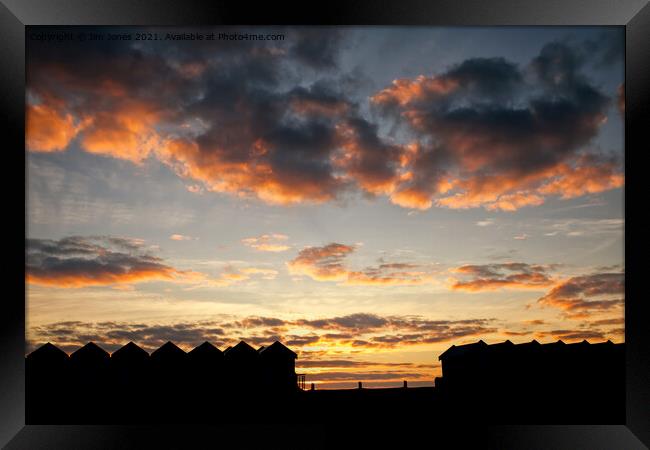 Silhouetted Beach Huts at Blyth Framed Print by Jim Jones