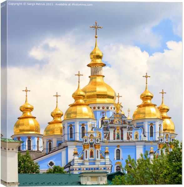 Golden domes of St. Michael's Golden-Domed Cathedral in Kiev in the spring against a blue cloudy sky on a warm spring day. Canvas Print by Sergii Petruk