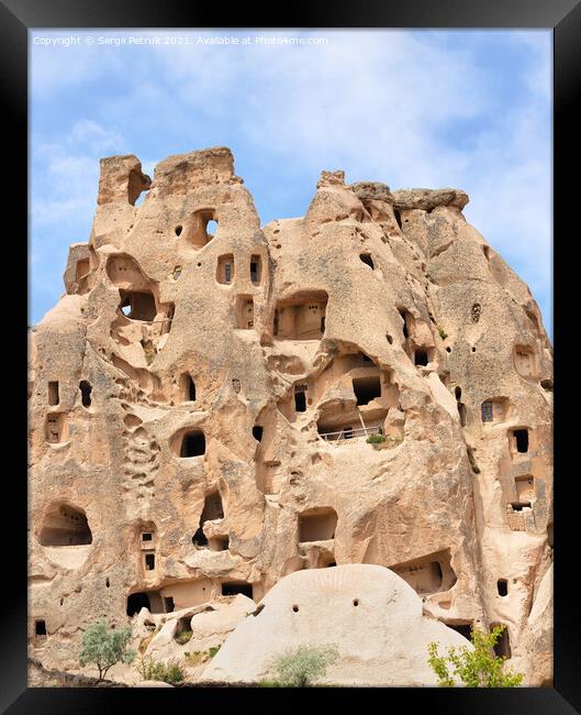 Ancient residential caves in the sandstone mountains of Cappadocia in Turkey. Framed Print by Sergii Petruk