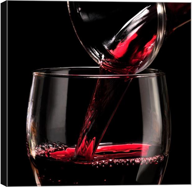 Pouring Red Wine Canvas Print by Phil Robinson