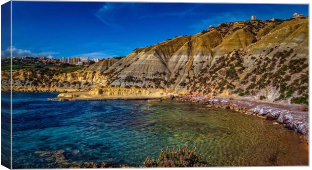 Blue coastline with hillside of the Maltese Island Canvas Print by Maggie Bajada