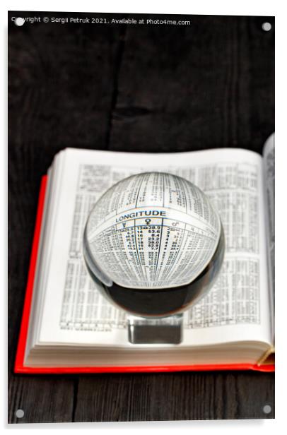 Crystal ball and opened book of ephemeris on blurred black wooden background. Acrylic by Sergii Petruk