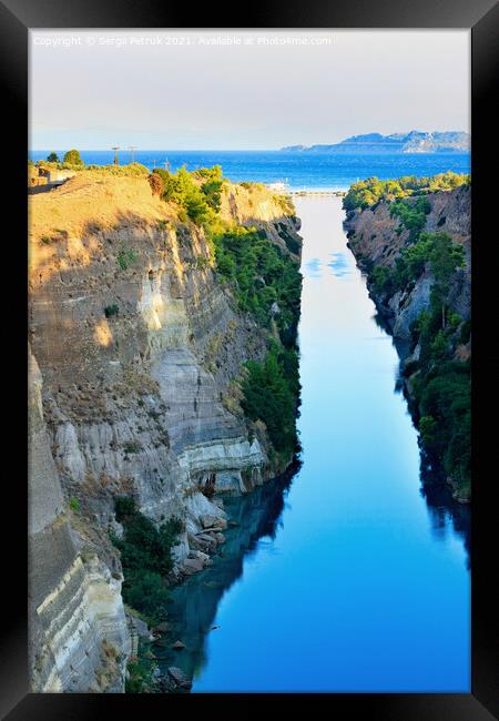 The narrow Corinth Canal in Greece, connecting the Aegean and Ionian Seas. Landscape on a sunny day. Framed Print by Sergii Petruk