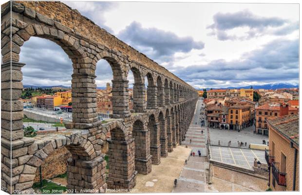 Roman Aqueduct at Segovia in Spain  Canvas Print by Jon Jones