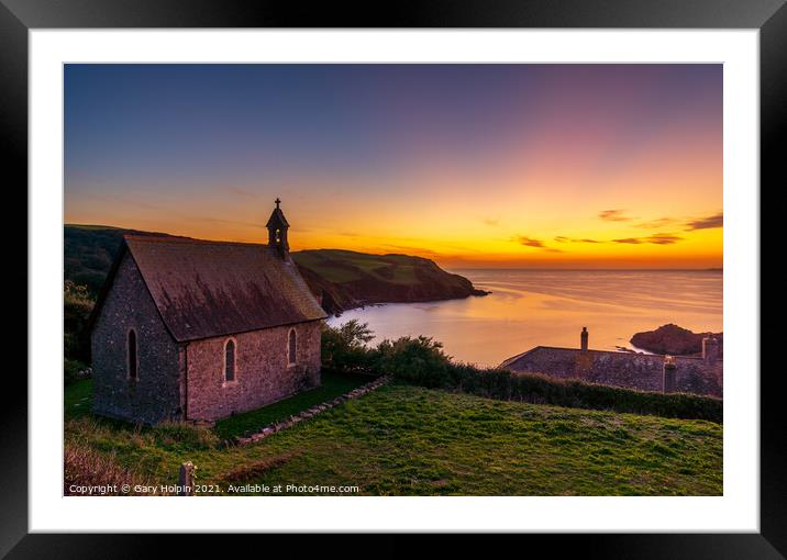 A sunset over the sea with a church in the foreground Framed Mounted Print by Gary Holpin
