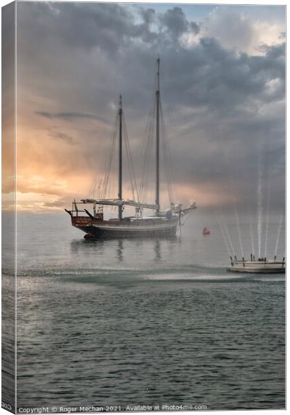 Misty Schooner on Lake Garda Canvas Print by Roger Mechan