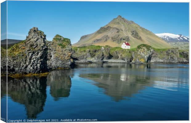 Iceland landscape. Little white house in Arnarstap Canvas Print by Delphimages Art
